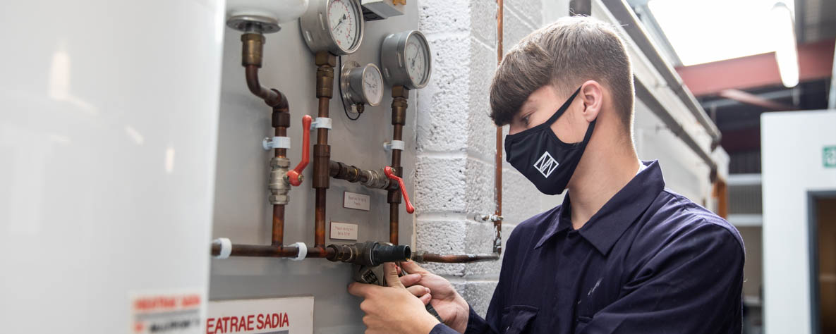 Ethan - Coleg Gwent plumbing student in mask