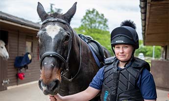 Equine student in yard