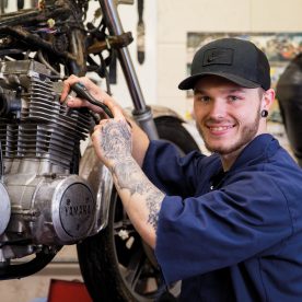 Student working on motorbike