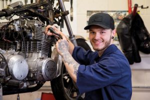 Student working on motorbike